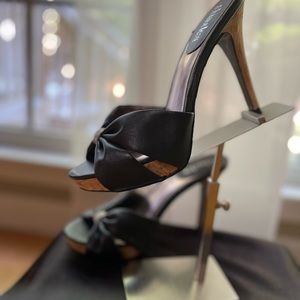 Black spiked heel, stacked,  front with accent of white/black band.